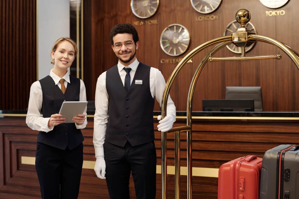 two young elegant employees luxurious hotel waiting new guests